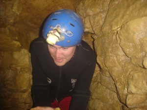 Climbing through a claustrophobic hole.
