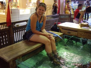 Kenna getting her feet cleaned by fishes