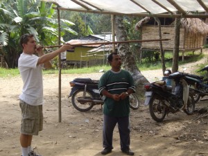 Scott using the blow pipe apparatus. And yes, that man (who is the chief of the village) is really that short.